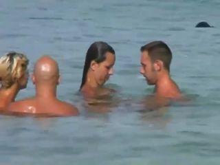 Swinging nudists spied on a beach GroupSex!-0