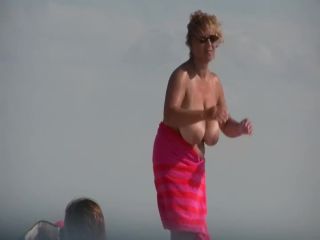 Gigantic mature tits on a beach Nudism-3