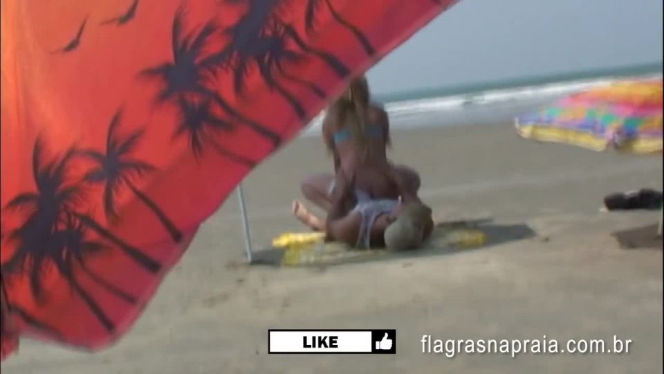 Brazilian couple having sex on the empty beach