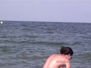 Pretty girl topless on the beach-0