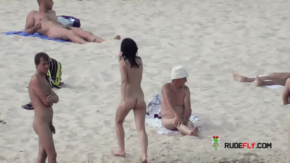 Guy spreading ass on nude  strand