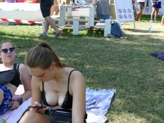 Shameless sunbathing in her black bra Voyeur!-0