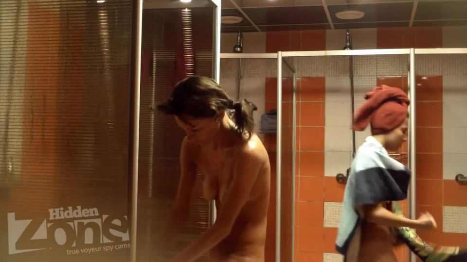 several naked girls in the shower. hidden cam