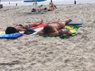 A beach voyeur is approching two nice girls because the bikini bra is so big that nipples are  visible-0
