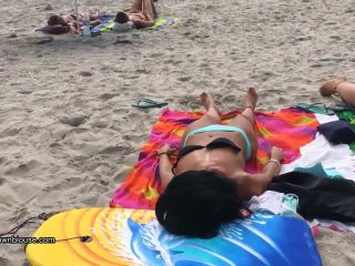 A beach voyeur is approching two nice girls because the bikini bra is so big that nipples are  visible-1