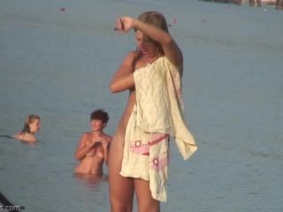 Pretty girl topless on the beach-1