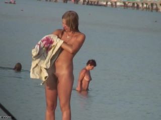 Pretty girl topless on the beach-2