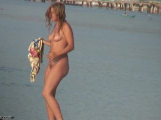 Pretty girl topless on the beach-8