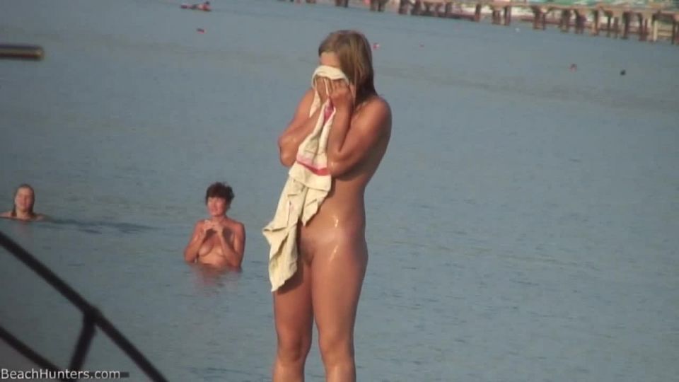 Pretty girl topless on the beach