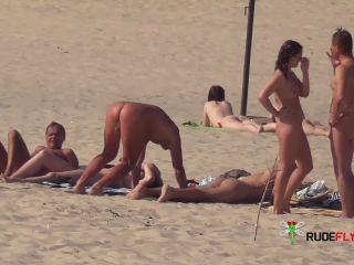 Slim girl with perky boobs naked at a nudist beach  3-1
